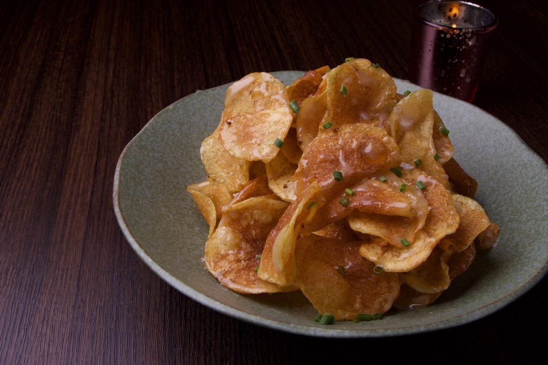 Honey butter chips in a celadon bowl
